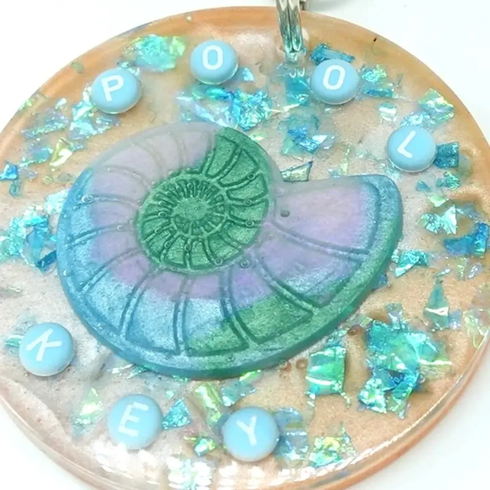 Tropical  Nautilus Shell resin Keychain with teal accents!  POOL KEY Chain